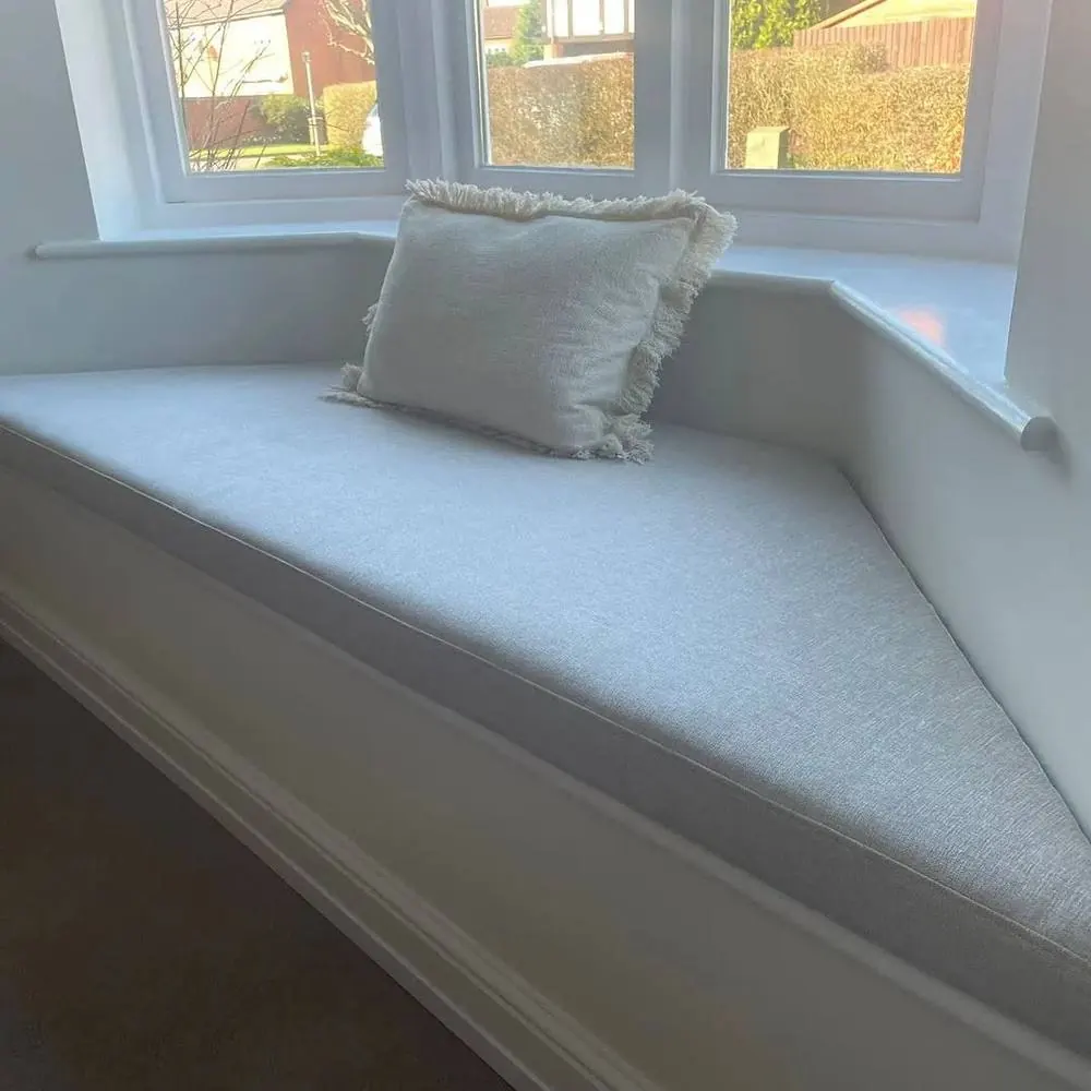 Built-in bay window seat with a padded cushion