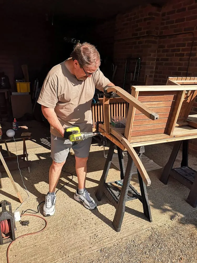 Sean shaping a piece of timber in the workshop